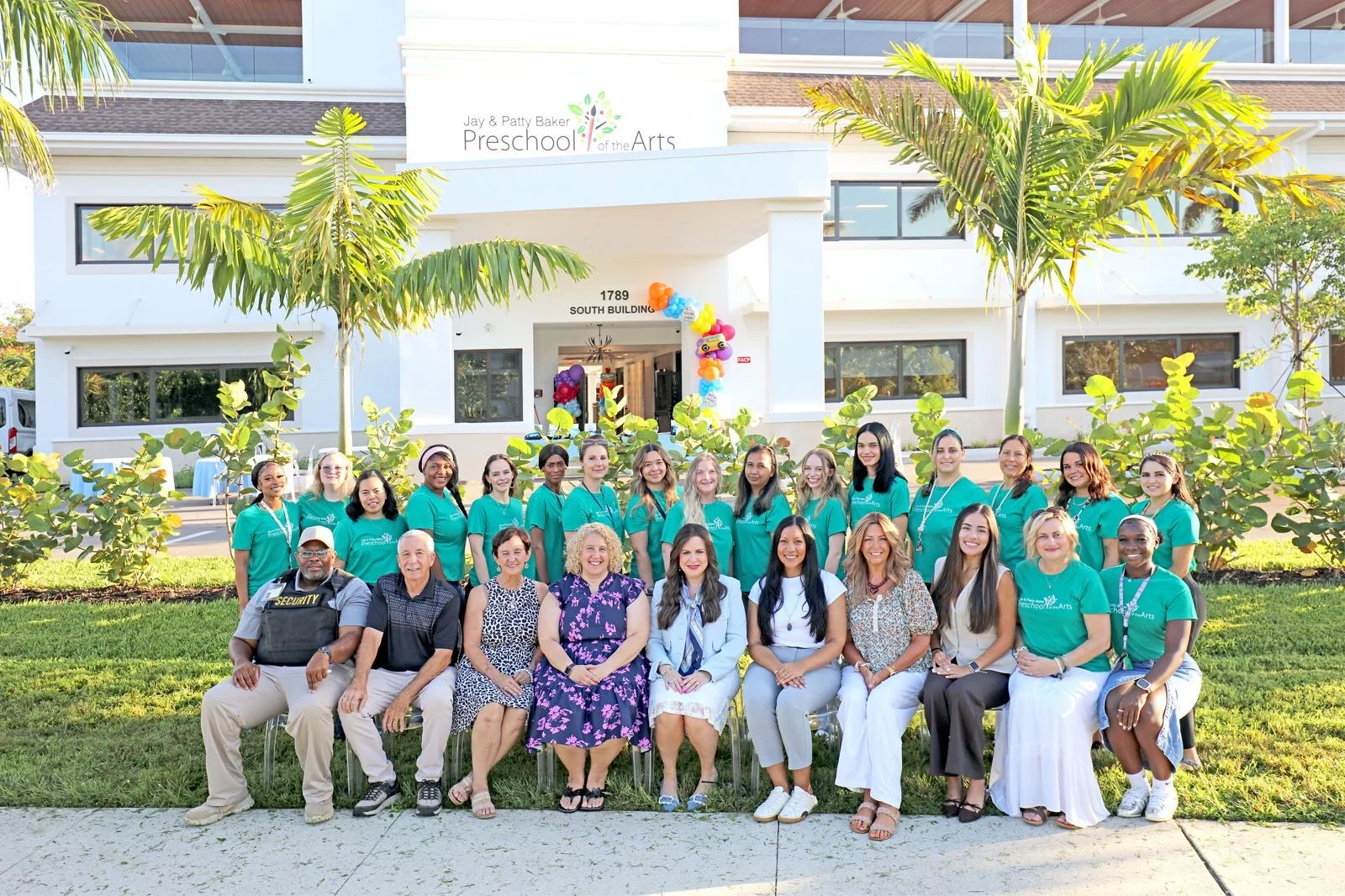Preschool of the Arts staff in front of the new building